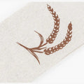 Handmade organic linen bread bag with brown wheat grain print design for eco-friendly loaf storage