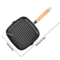 Cast iron square grill pan with ridged cooking surface, wooden handle, and drip spout. Dimensions shown: 23cm x 38.5cm.