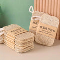 Natural loofah dish scrubbers with rope handles, displayed in tan/beige color against green and peach background with product