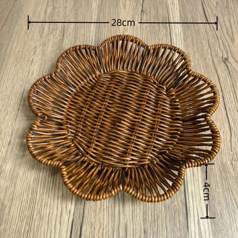 Hand-woven rattan bread basket with flower-shaped design, natural golden-brown weave, measuring 28cm wide by 4cm deep.