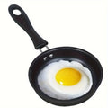 Black cast iron skillet with fried egg, featuring ergonomic handle and non-stick cooking surface for everyday meal preparatio