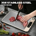 304 stainless steel food-grade cutting board with slip-resistant base, shown cutting raw meat with knife in kitchen setting.