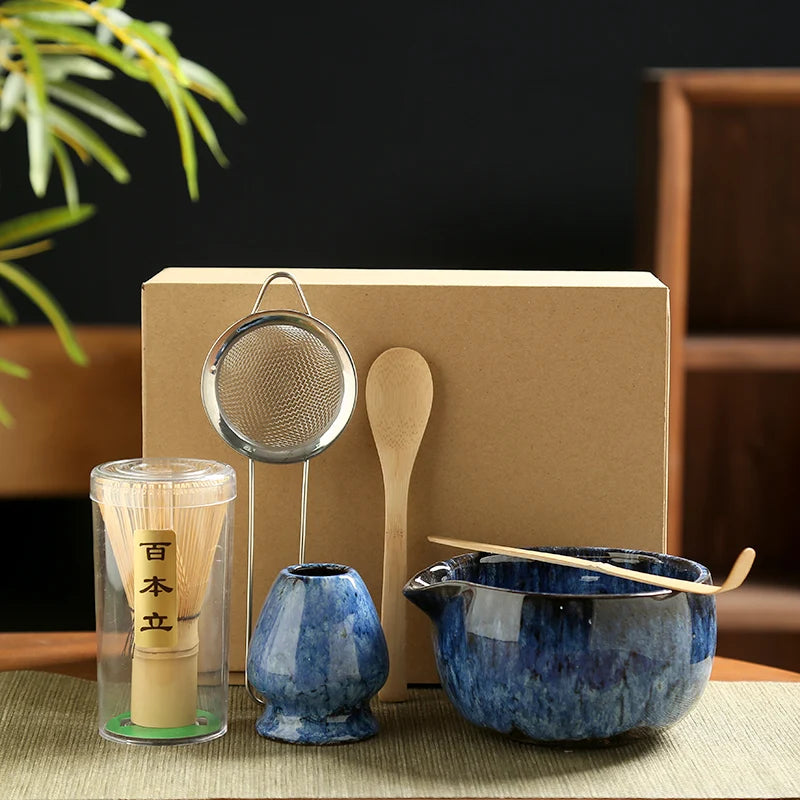 Japanese Matcha Bamboo Tea Set with ceramic blue bowls, bamboo whisk and spoon, stainless steel strainer, displayed with kraf