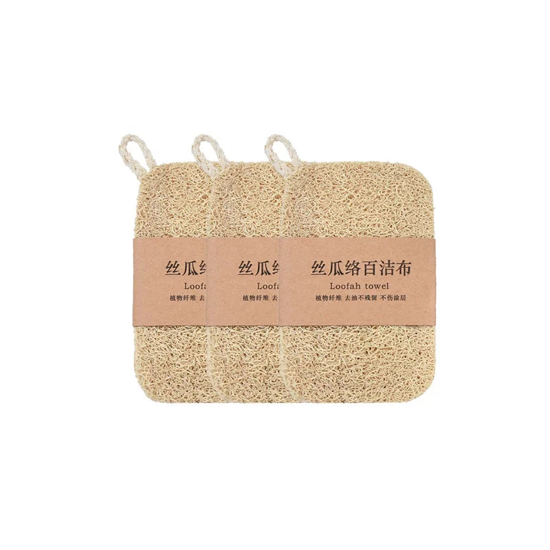 Three natural loofah dish scrubbers with rope loops, packaged together with kraft paper band and Chinese text labeling.