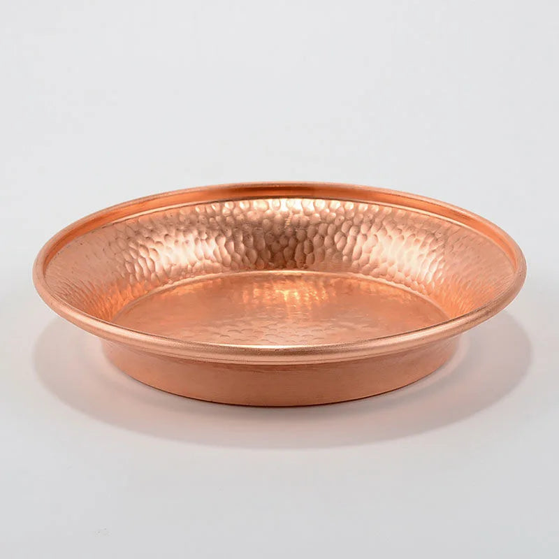 Pure copper serving plate with hammered texture, wide shallow bowl design, polished finish on neutral background.