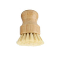 Bamboo dish brush with natural bristles and replaceable head, eco-friendly kitchen cleaning tool for sustainable home care.
