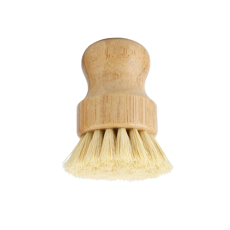 Bamboo dish brush with natural bristles and replaceable head, eco-friendly kitchen cleaning tool for sustainable home care.
