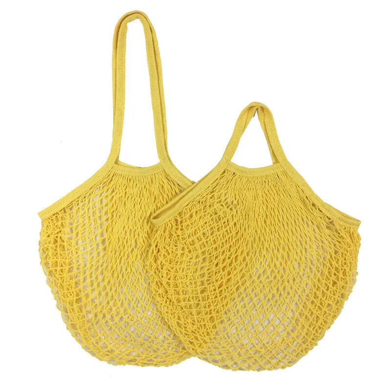Two yellow cotton mesh grocery bags with long handles, displayed side by side, ideal for carrying produce and groceries plast