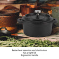 Black cast iron Dutch oven pot with tight-fitting lid and ergonomic handles, displayed with ingredients and rustic kitchen it