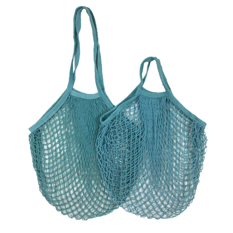 Two teal cotton mesh produce bags with long handles, ideal for eco-friendly grocery shopping and storage.