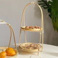 Two-tier natural bamboo basket set with woven handles holding walnuts and dried goods, eco-friendly pantry storage decor.