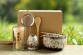 Japanese matcha tea set with bamboo whisk, wooden spoon, ceramic bowls, strainer, and whisk holder on eco-friendly kraft pack