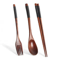 Wooden cutlery set with fork, spoon, and chopsticks featuring dark wood handles with black grip wrapping and natural finish b