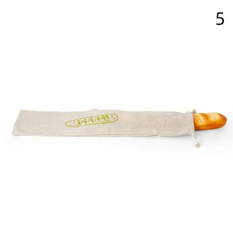 Handmade organic linen bread bag with wooden handle, featuring embroidered baguette design for eco-friendly loaf storage.