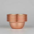 Pure copper dining bowl with ribbed rim detail, showcasing warm metallic finish against dark background for eco-friendly kitc