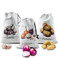 Three white canvas drawstring bags labeled Garlic, Onion, and Potato with illustrated vegetables and fresh produce displayed 