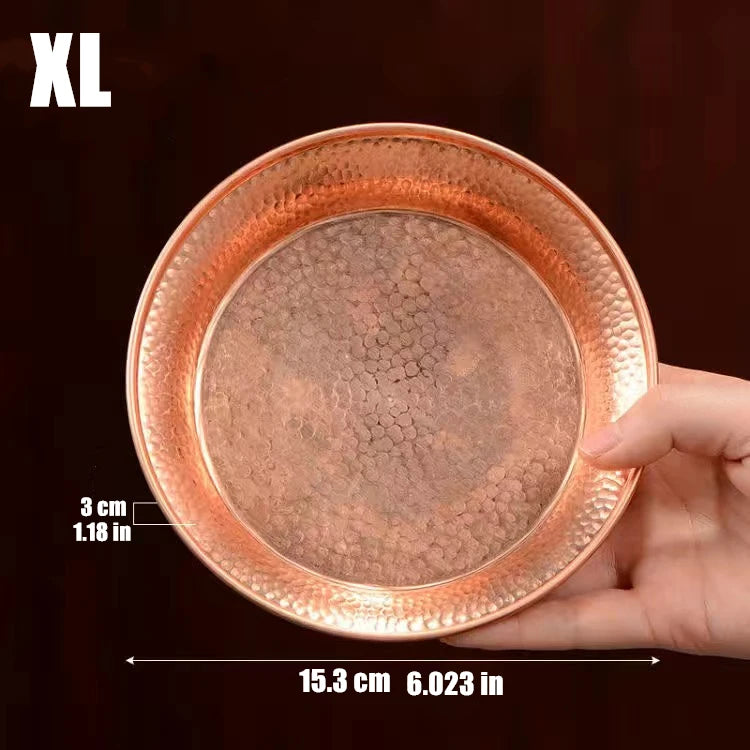 Pure copper serving plate with hammered texture, 15.3cm diameter, shown in hand against dark background with size measurement