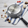 GraniteStone Fusion non-stick fry pan with gray granite coating, stainless steel perforated surface, black handle, surrounded