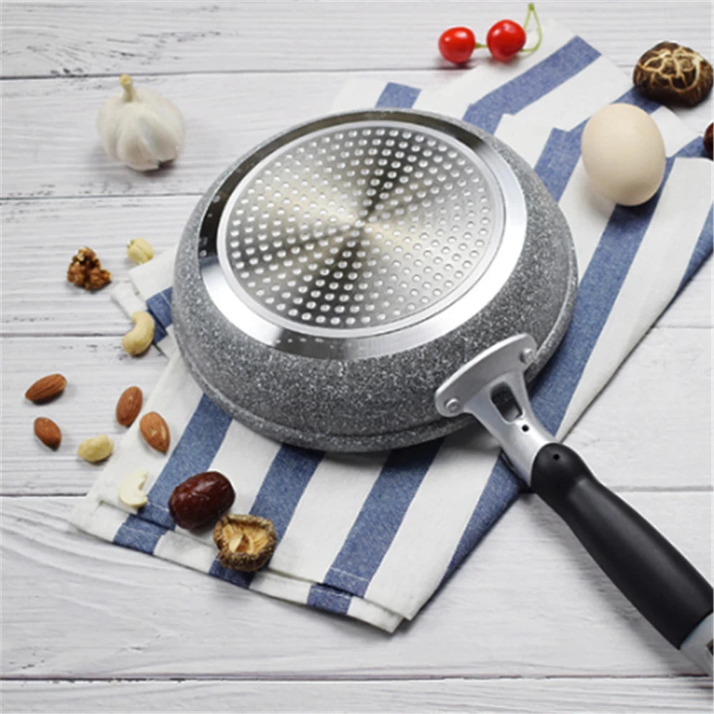 GraniteStone Fusion non-stick fry pan with gray granite coating, stainless steel perforated surface, black handle, surrounded