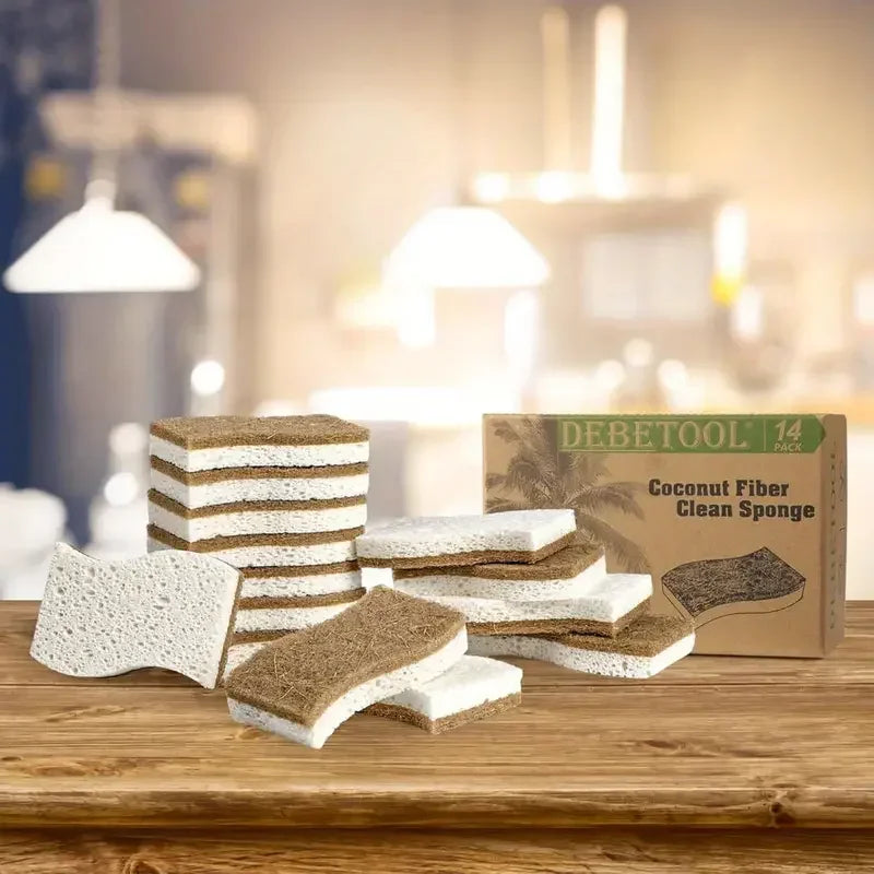 Debetool coconut fiber clean sponges displayed on wooden surface with packaging box showing natural tan and white layered spo