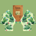 Beeswax food wrap set with organic cotton featuring green cactus print design, displayed with product packaging on pale green