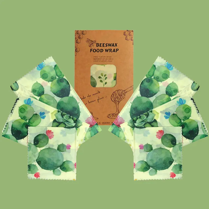 Beeswax food wrap set with organic cotton featuring green cactus print design, displayed with product packaging on pale green