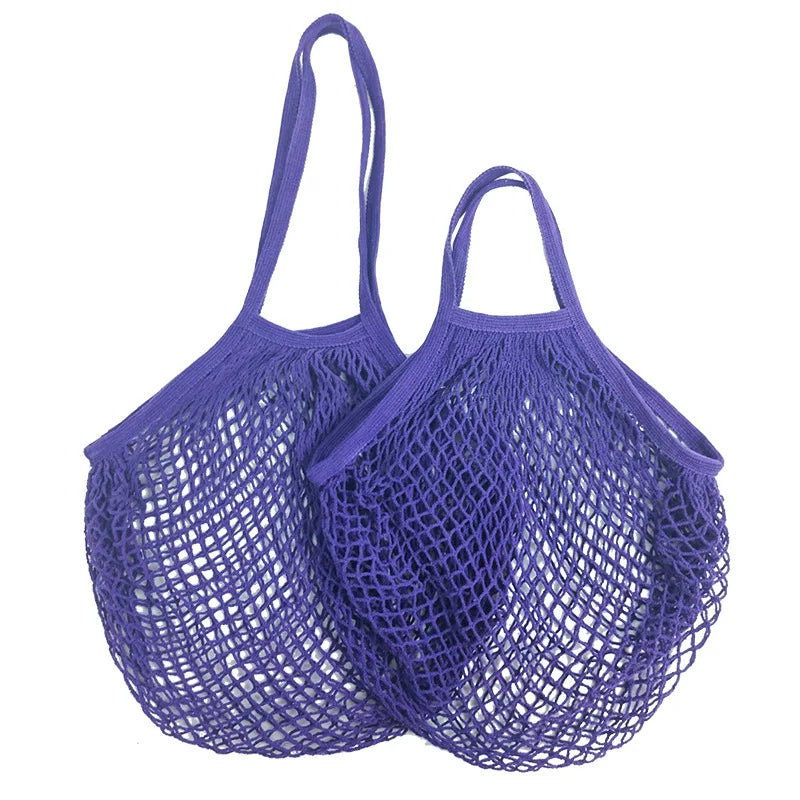 Two purple cotton mesh produce bags with long handles, ideal for carrying vegetables and groceries while reducing plastic was