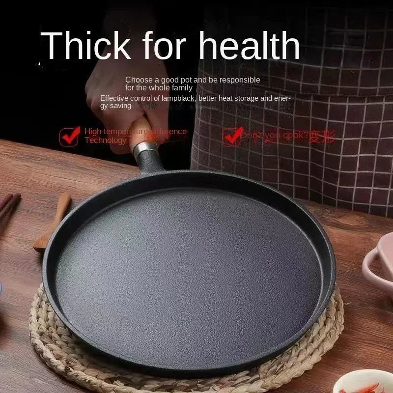 Cast iron egg skillet with thick base on woven placemat, featuring high temperature technology and energy-efficient design fo