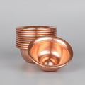 Pure copper dining bowl set with stacked bowls showing polished interior finish and hammered texture on wooden surface.