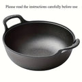 Black cast iron double-handle pot with curved sides and textured handles, displayed against white background.