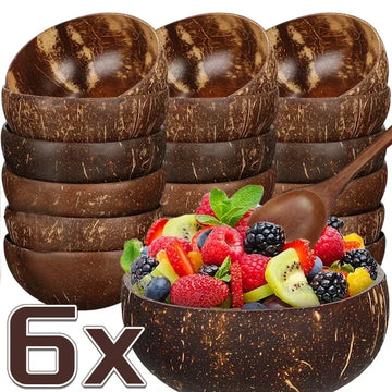 Six natural coconut bowls with wooden spoon, one filled with fresh berries and fruit slices, displayed against white backgrou
