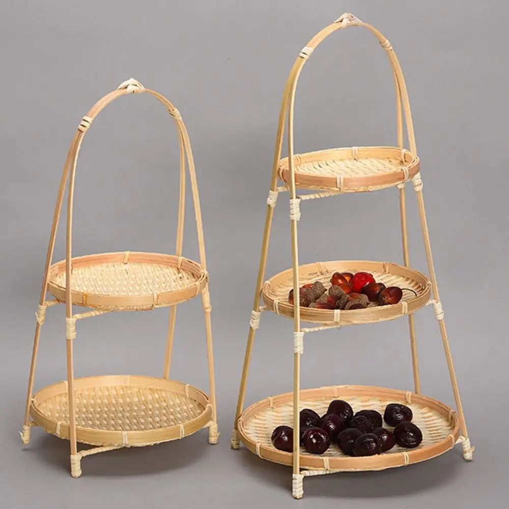 Two-tier bamboo baskets with arched handles, displaying dried fruits and berries, natural woven construction with rope accent