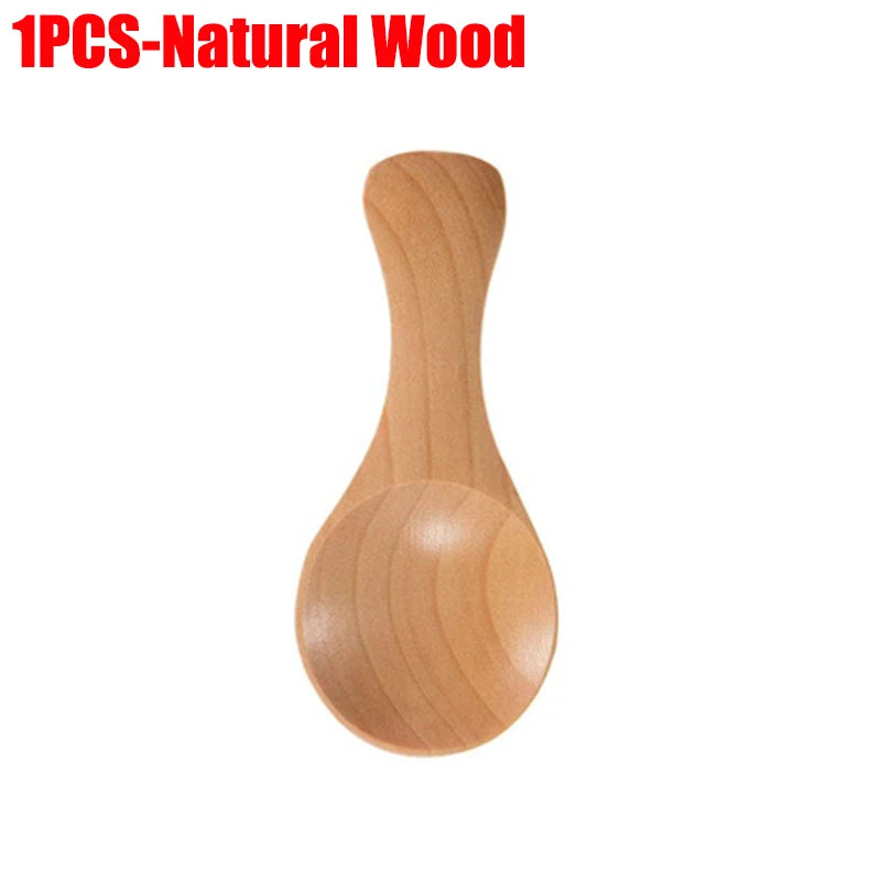 Natural wood mini scoop spoon with rounded bowl and tapered handle, ideal for tea, honey, and coffee measurements.