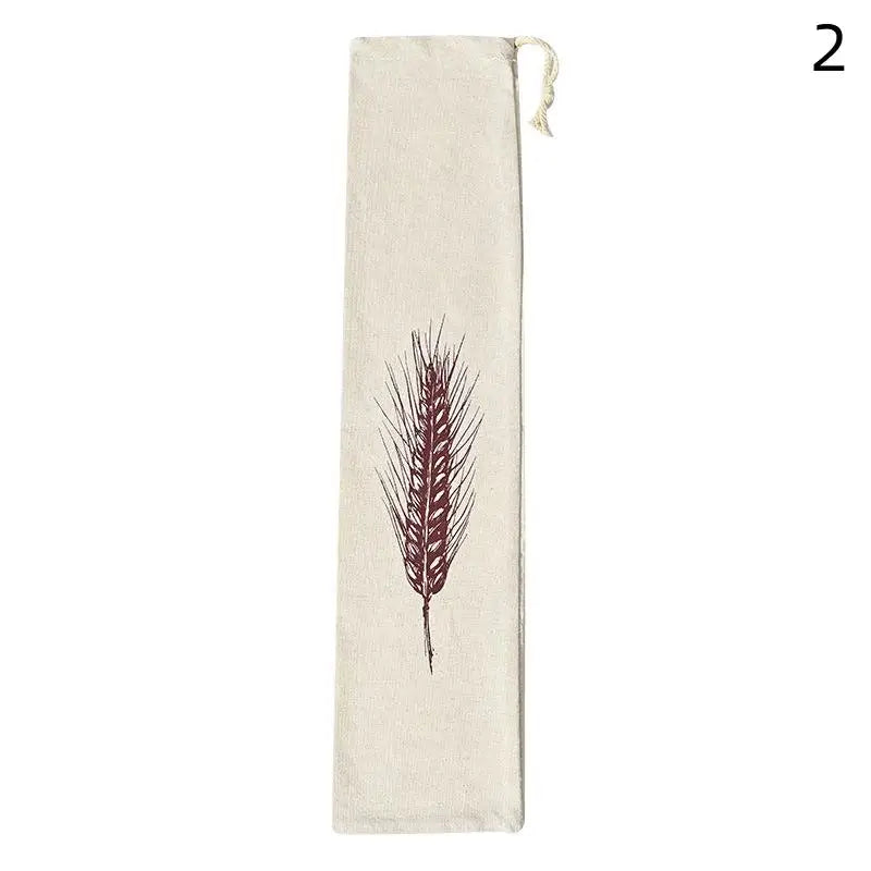Handmade organic linen bread bag with burgundy wheat grain design, drawstring closure, reusable eco-friendly loaf storage.