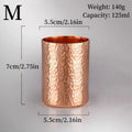 Hammered copper mug size M with 125ml capacity, showing textured surface and dimensions of 7cm height by 5.5cm width