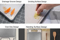 Stainless steel cutting board with drainage grooves, grinding surface, oval grip, and slip-resistant design, shown with citru