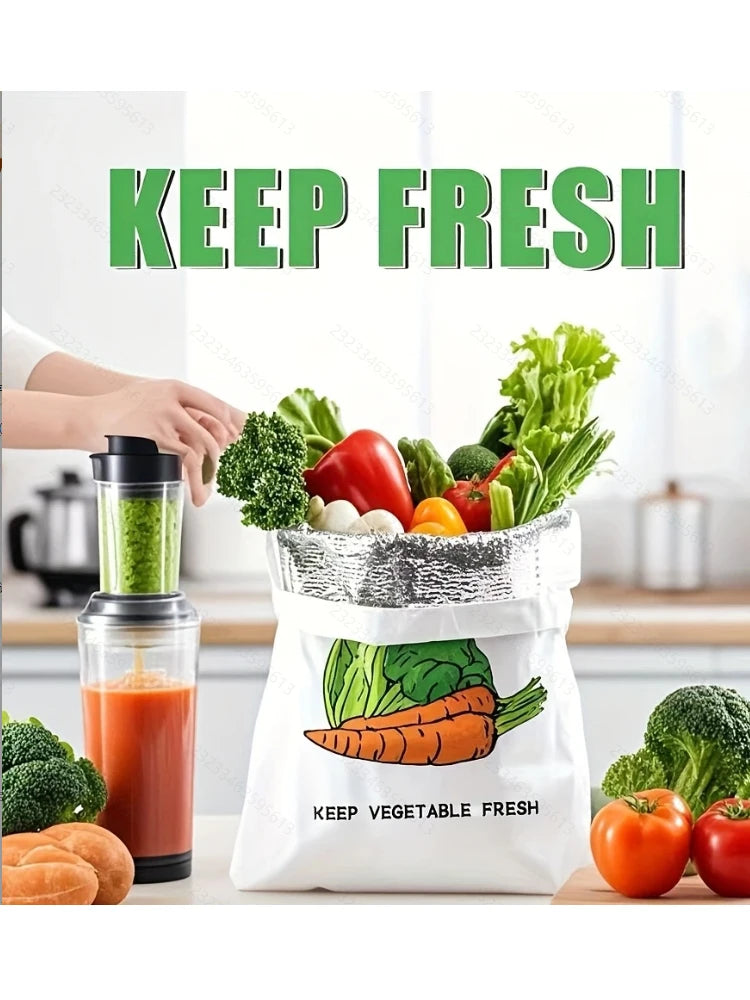 Insulated reusable storage bag with carrot design, holding fresh vegetables and broccoli in bright kitchen setting with blend
