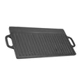 Cast iron dual-sided griddle with grill ridges and handles, black finish, versatile for outdoor and indoor cooking.