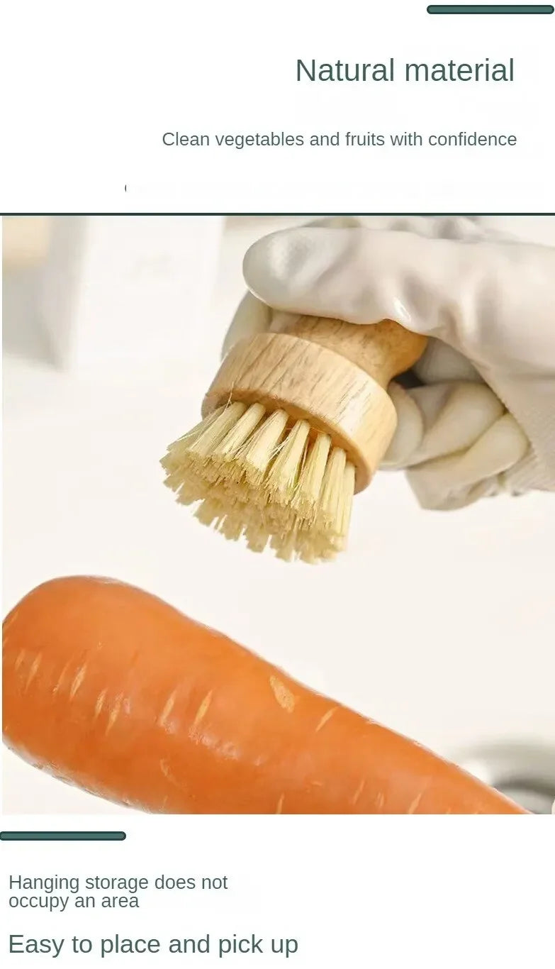 Wooden natural dish brush with coconut fiber bristles being used to clean a carrot, demonstrating eco-friendly cleaning.