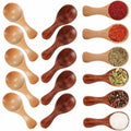 Wooden measuring scoops and spoons in natural bamboo and dark wood, filled with various spices, tea, and ingredients, display