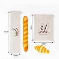 Two natural linen bread bags with wheat design, displaying storage capacity for baguettes and loaves, dimensions shown with f