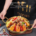 Golden stainless steel wok pan with dual handles and hollow anti-scalding design, filled with cooked shrimp and vegetables, d