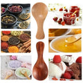Bamboo mini scoop spoon with natural wood finish, surrounded by tea, spices, honey, berries, and salt imagery showcasing vers