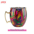 Colorful insulated copper travel mug with vibrant abstract swirl design, stainless steel interior, and gold-tone handle.