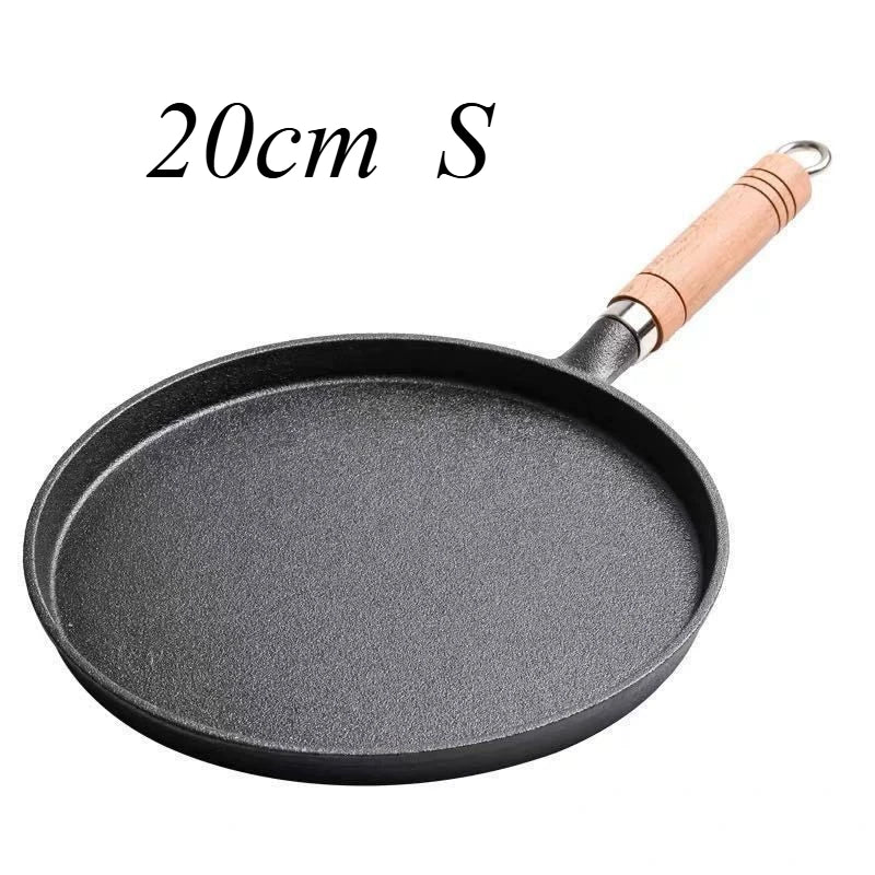20cm cast iron skillet with wooden handle, non-stick cooking surface, ideal for eggs and breakfast cooking.