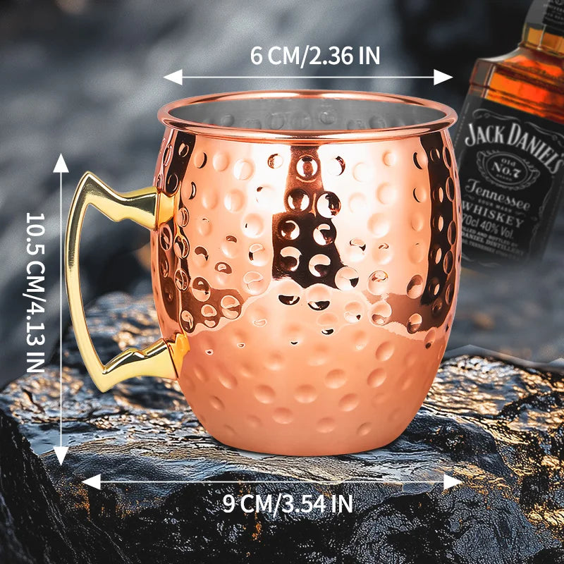 Copper hammered finish insulated travel mug with brass handle, dimensions 10.5cm height x 9cm base x 6cm rim width.