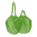 Two green cotton mesh grocery bags with long handles, ideal for carrying vegetables and produce at the market.