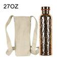 27oz copper insulated water bottle with hammered finish and rose gold cap, shown with beige canvas carrying case with shoulde