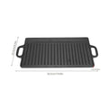 Cast iron dual-sided griddle with ribbed grill surface, dual handles, dimensions 50.5cm x 23.5cm, black finish for indoor and