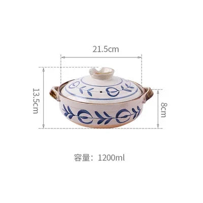 Earthenware clay casserole pot with blue floral design, 1200ml capacity, featuring handles and lid, dimensions 21.5cm x 13.5c